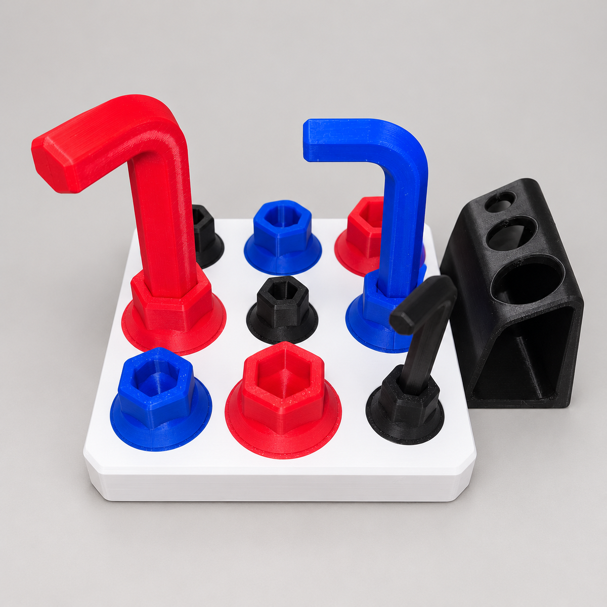 Allen Key Activity Board with red, blue and black screw pieces and matching tools on a white base