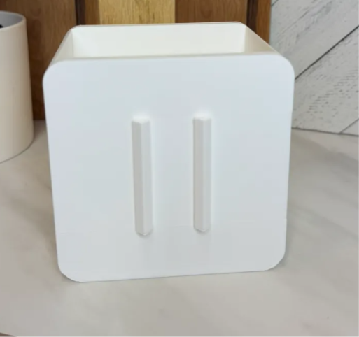 White interchangeable pen and pencil holder base shown without a cover; cover sold separately.