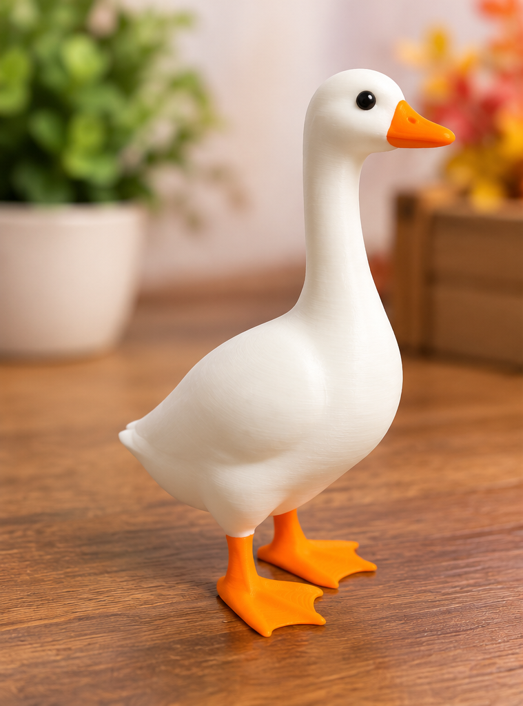 Mini Desk Goose side view, white body with orange beak and feet