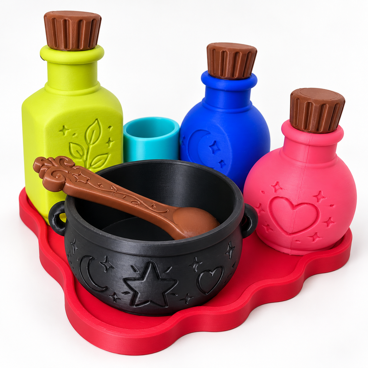 Potion Play Set on a white background with colorful bottles, black cauldron, brown spoon, teal cup and red tray
