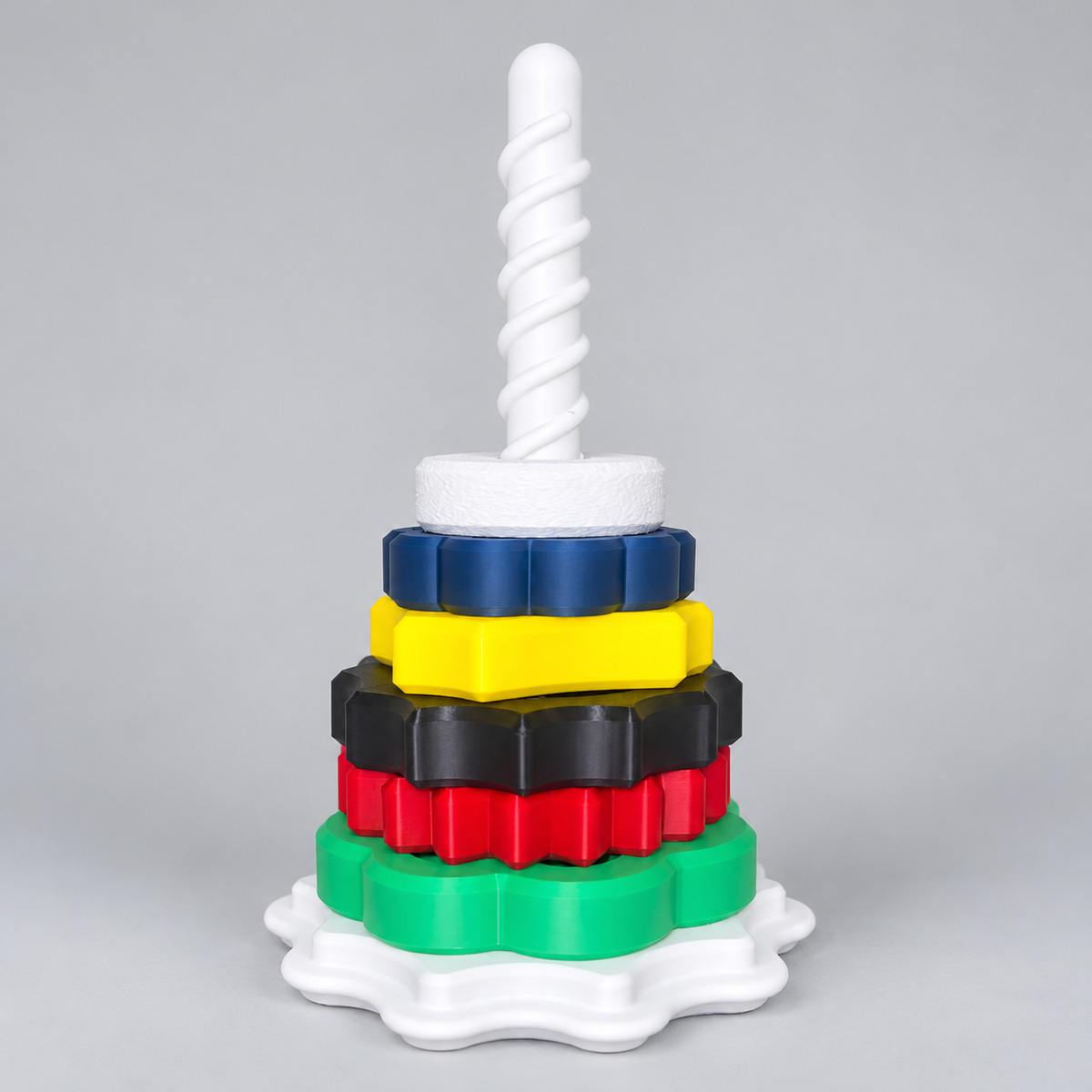 Spin & Stack Tower with colorful rings on a clean neutral background