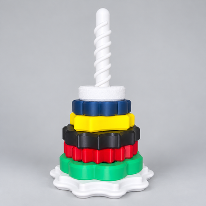 Spin & Stack Tower with colorful rings on a clean neutral background
