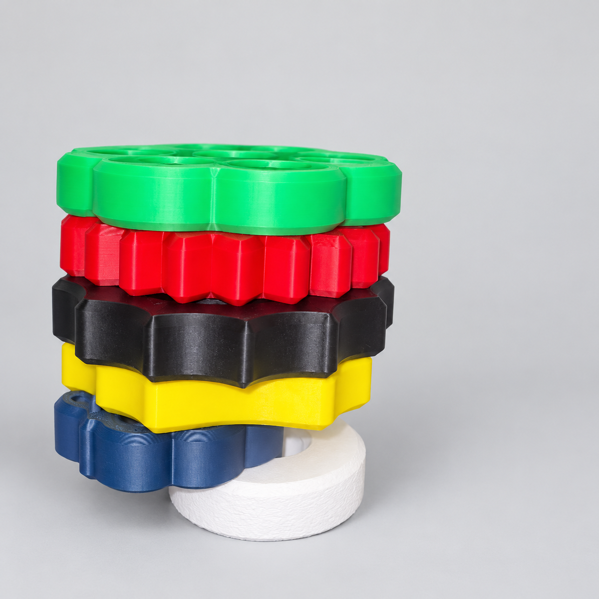 Spin & Stack Tower with colorful rings on a clean neutral background